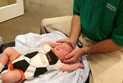 infant receiving chiropractic East Cobb Pediatric Care
