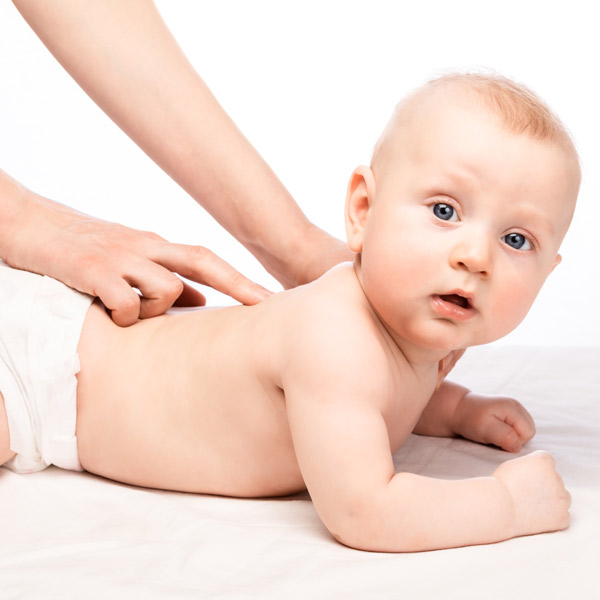 A baby receiving a gentle adjustment