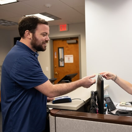 patient checking in at front desk