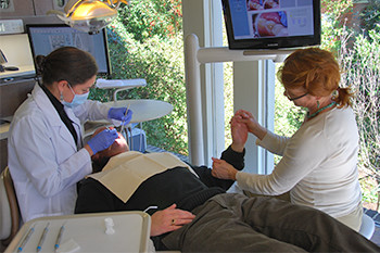 Downtown Greenville dentist Dr. Beatriz Dennis with patient