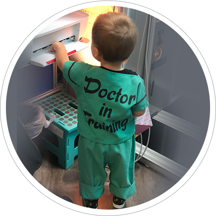 Child with doctor shirt