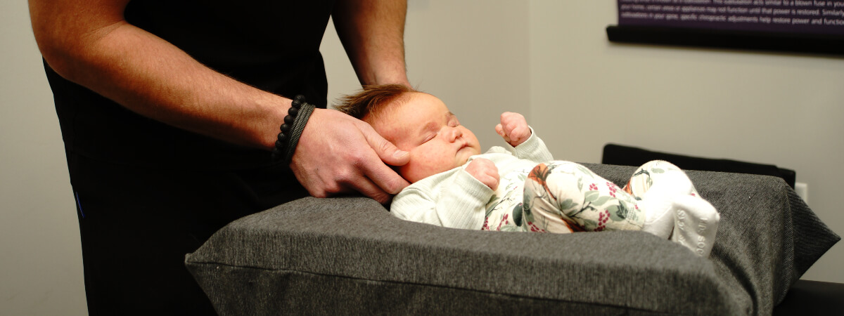 Mankato chiropractor adjusting a baby