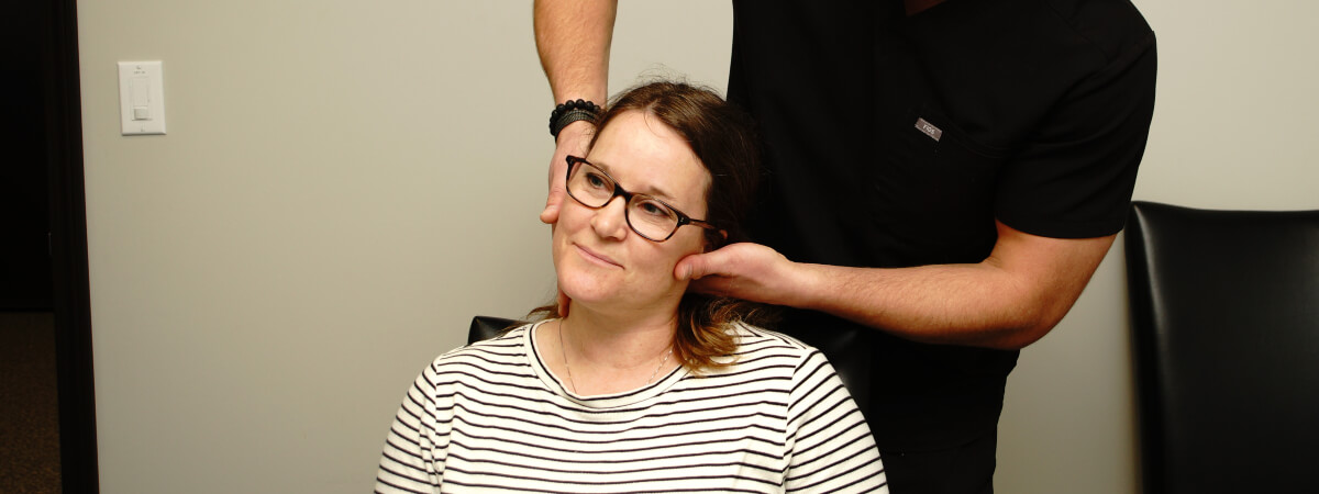 Mankato chiropractor adjusting a patient's neck