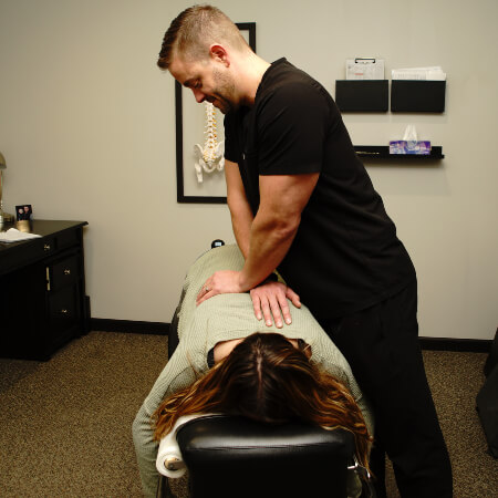Mankato chiropractor adjusting a patient's back