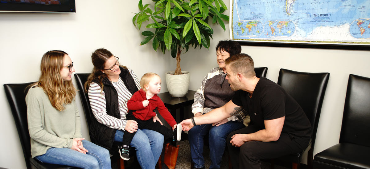 Dr. Rignell in waiting room with patients