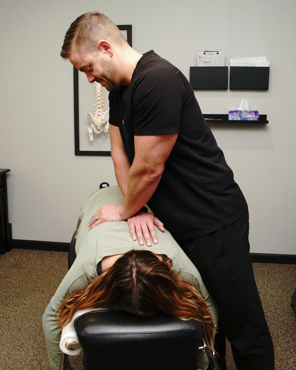 Dr. Brandon adjusting patient