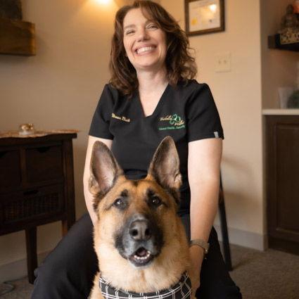 Dr. Dawn Buik smiling with Max