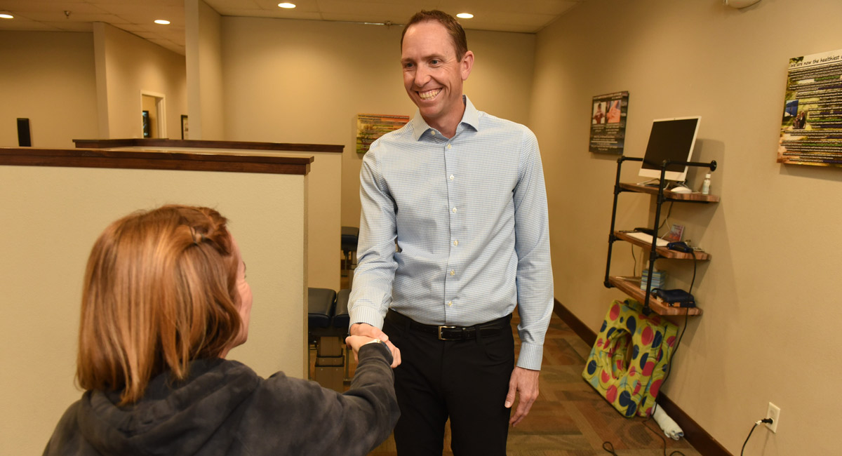 Dr. Jerod greeting a patient