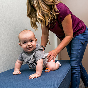 Baby on an adjusting table