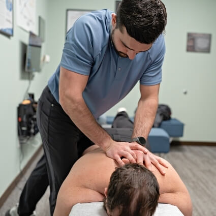 patient having their upper back adjusted