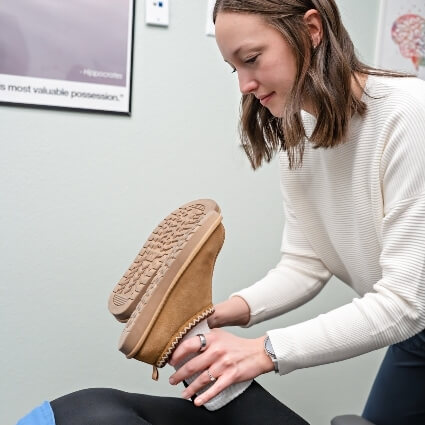 patient having feet examined