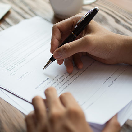 person filling out paperwork