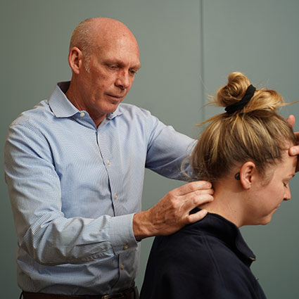 Dr Murray adjusting patient