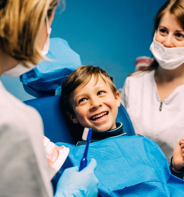 Young boy sitting on a dental chair