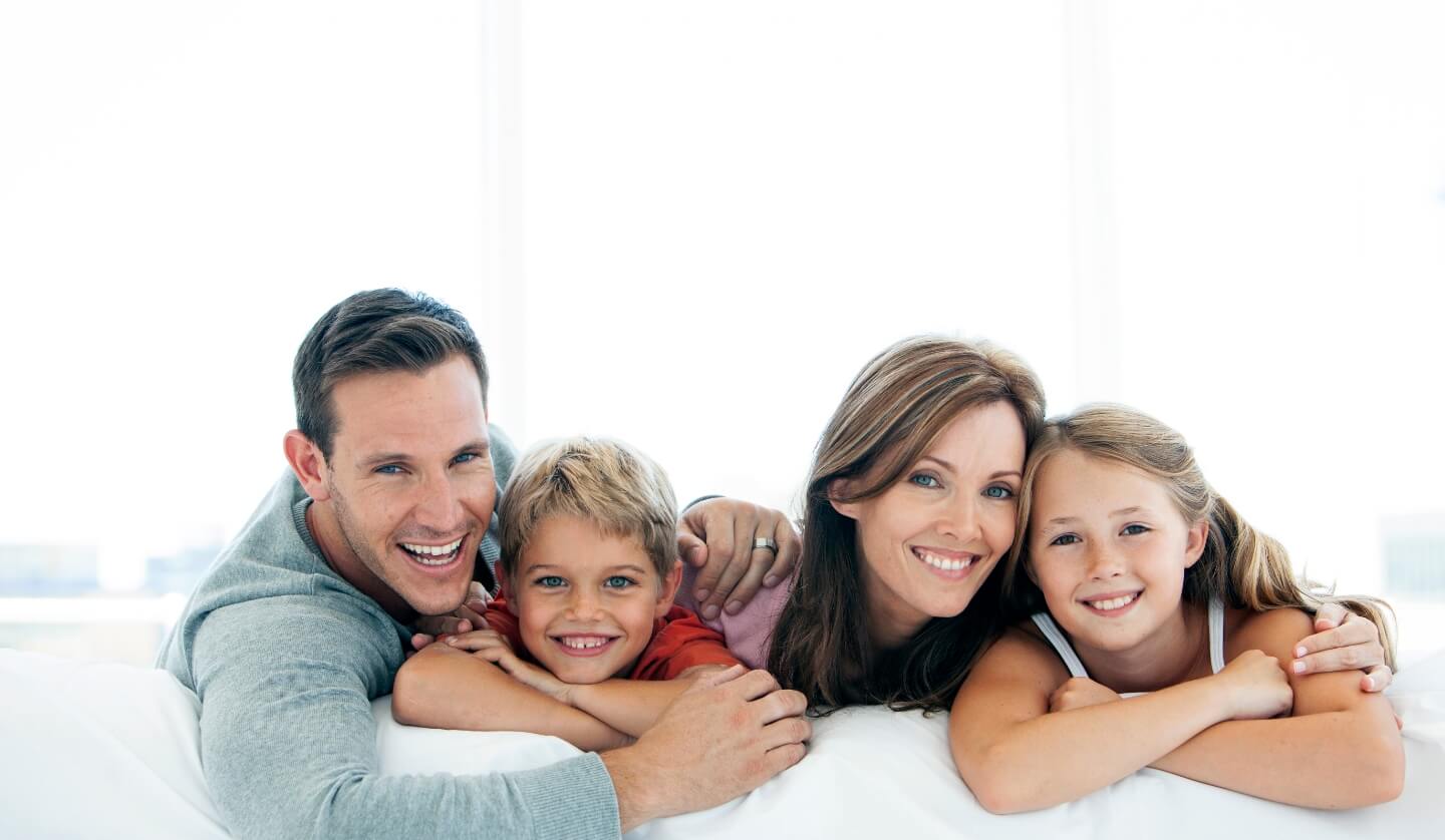 Smiling family of four
