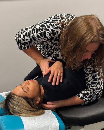 Barrie chiropractor adjusting patient's back