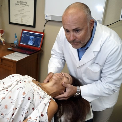 Dr adjusting patients neck