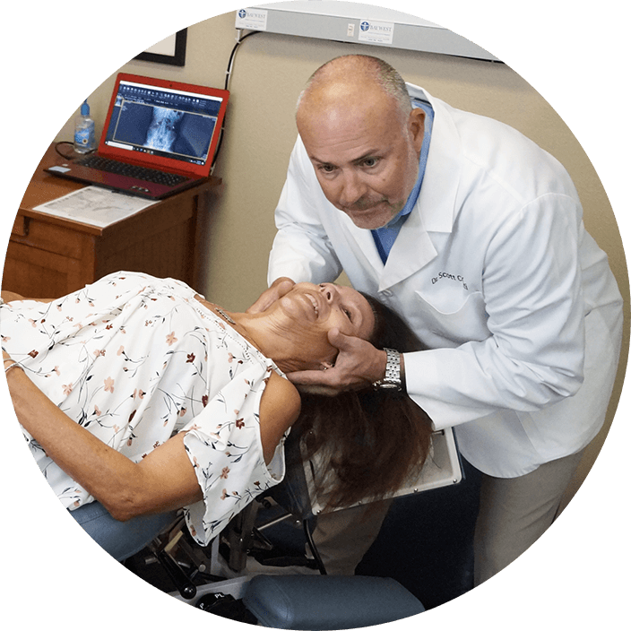 Doctor adjusting patients neck