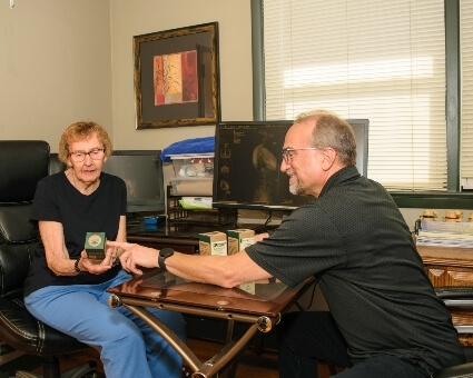 Medford chiropractor in consultation with patient