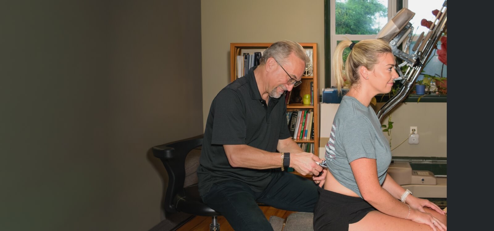 Medford patient being treated with a chiropractic tool