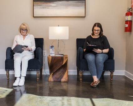 Patients in waiting room at Bryant Family Chiropractic