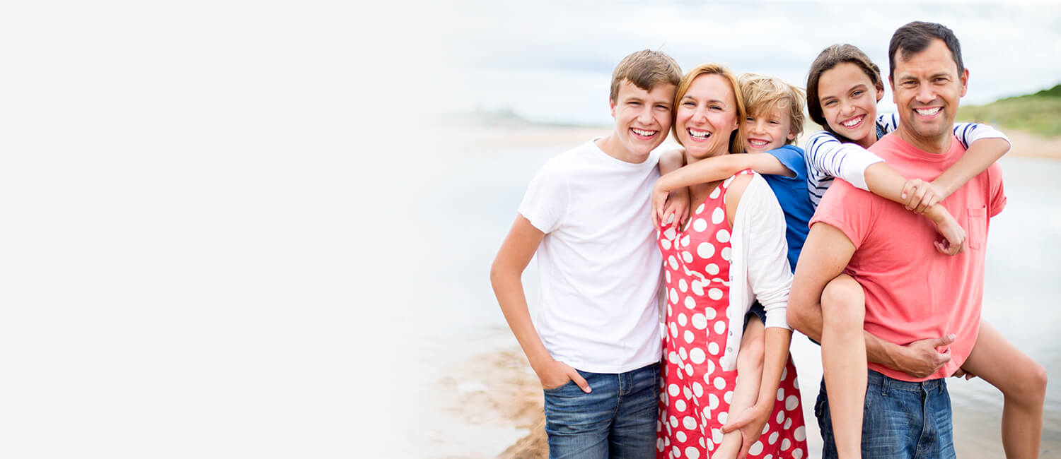 Family of five smiling