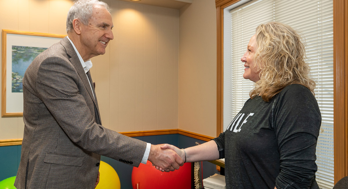 Dr. Bennett shaking hands with a patient