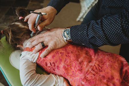 Instrument Adjustment on little girl