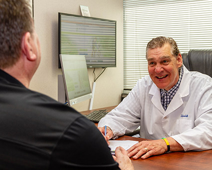 Dr Schmidt talking to patient