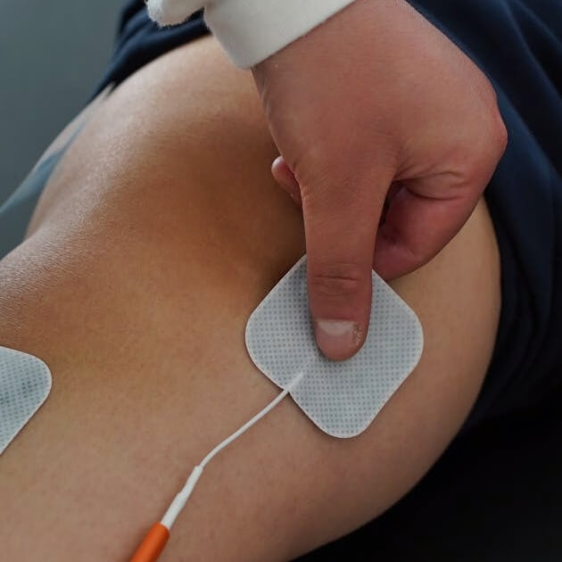 Electrical Muscle Stimulation used to treat a patient