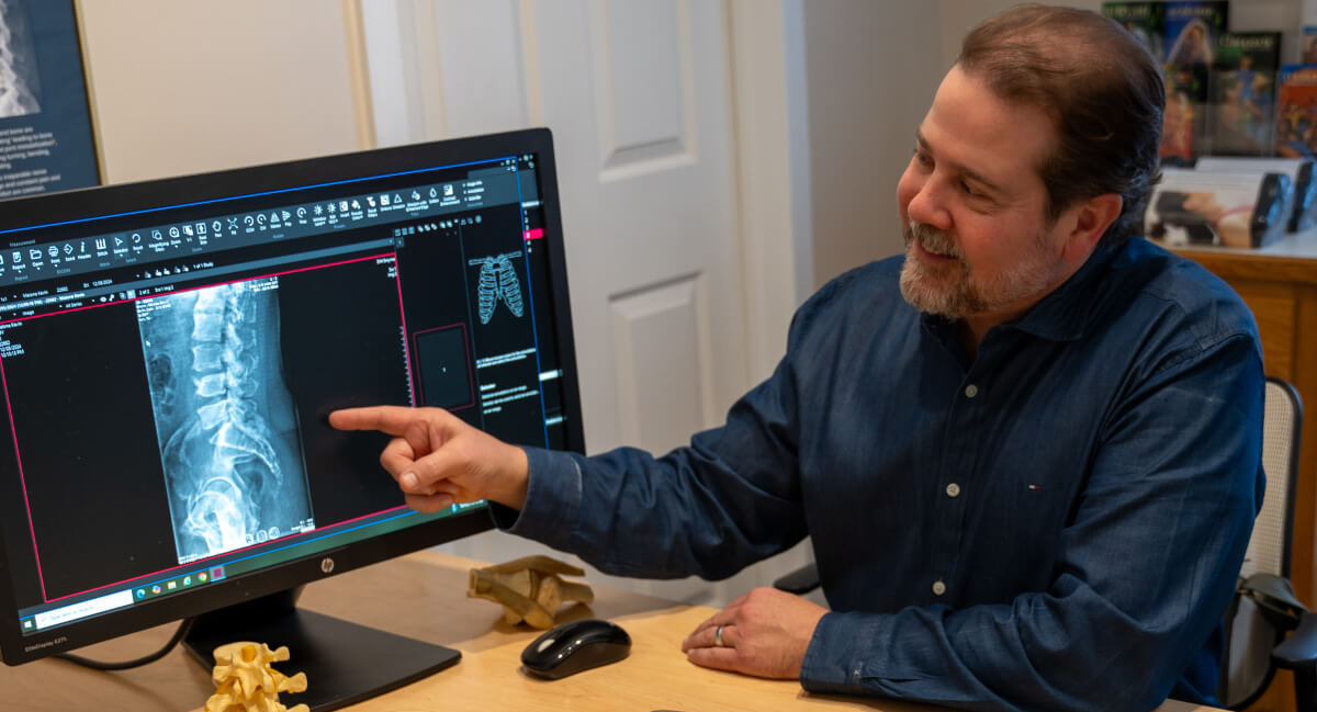 Dr. Kirk pointing at x-ray
