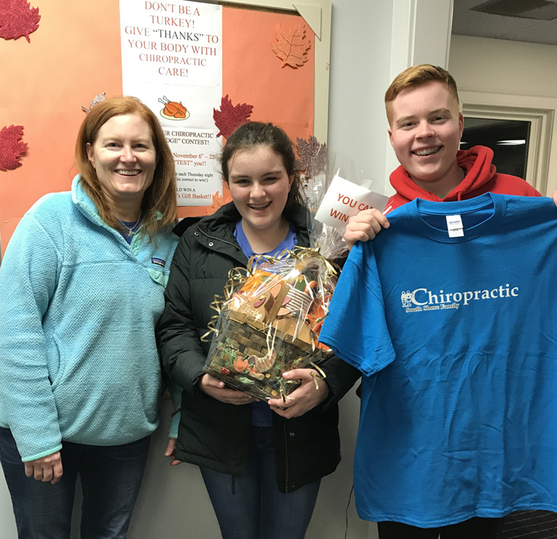 Patients holding gift basket and t-shirt