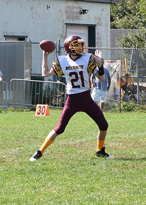 Football player throwing ball