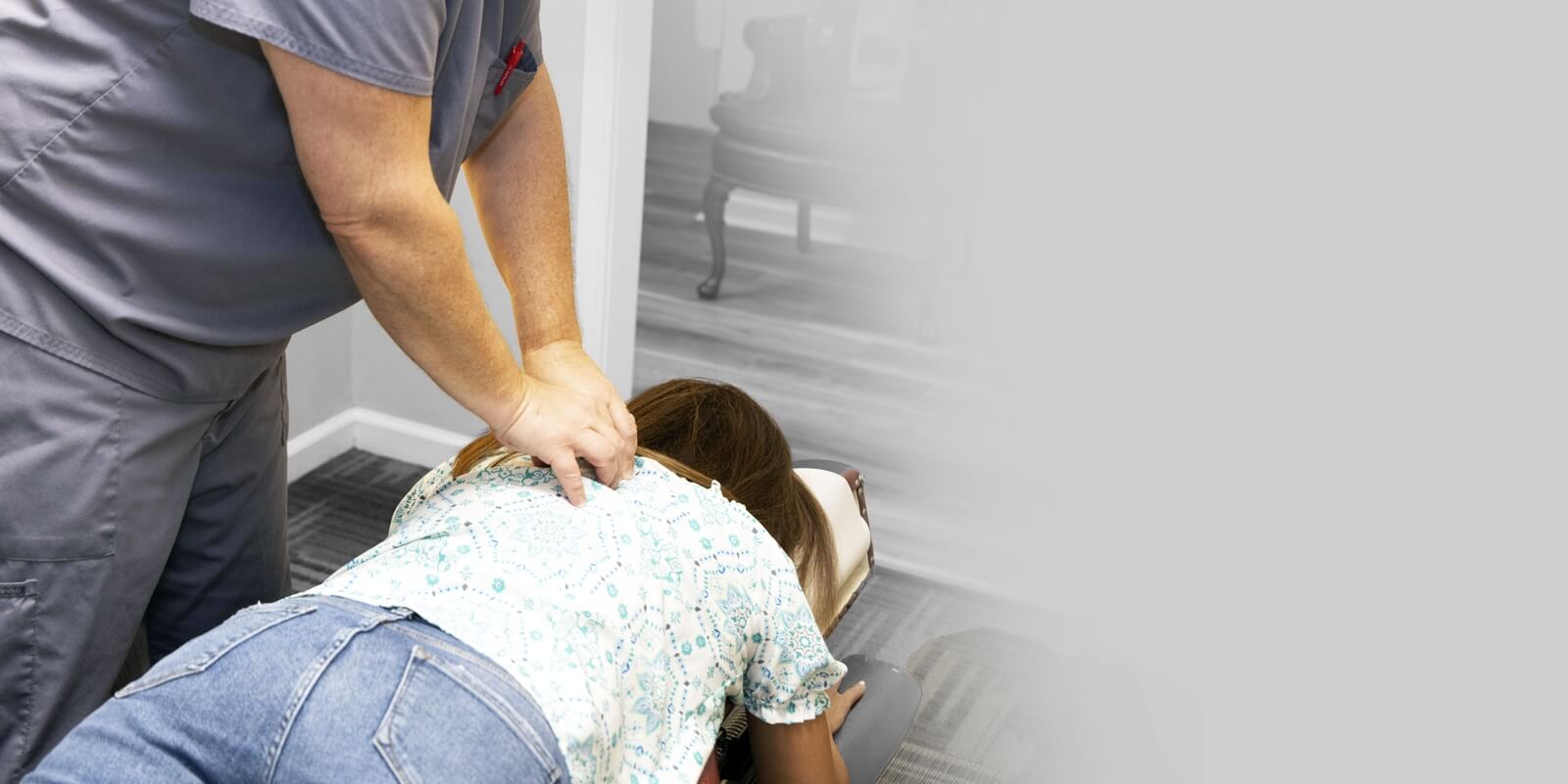 pressing on woman's back