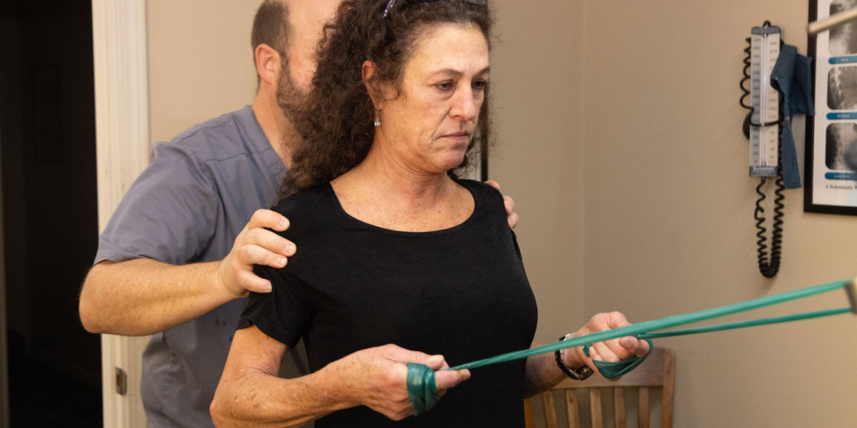 Assisting woman with therapy