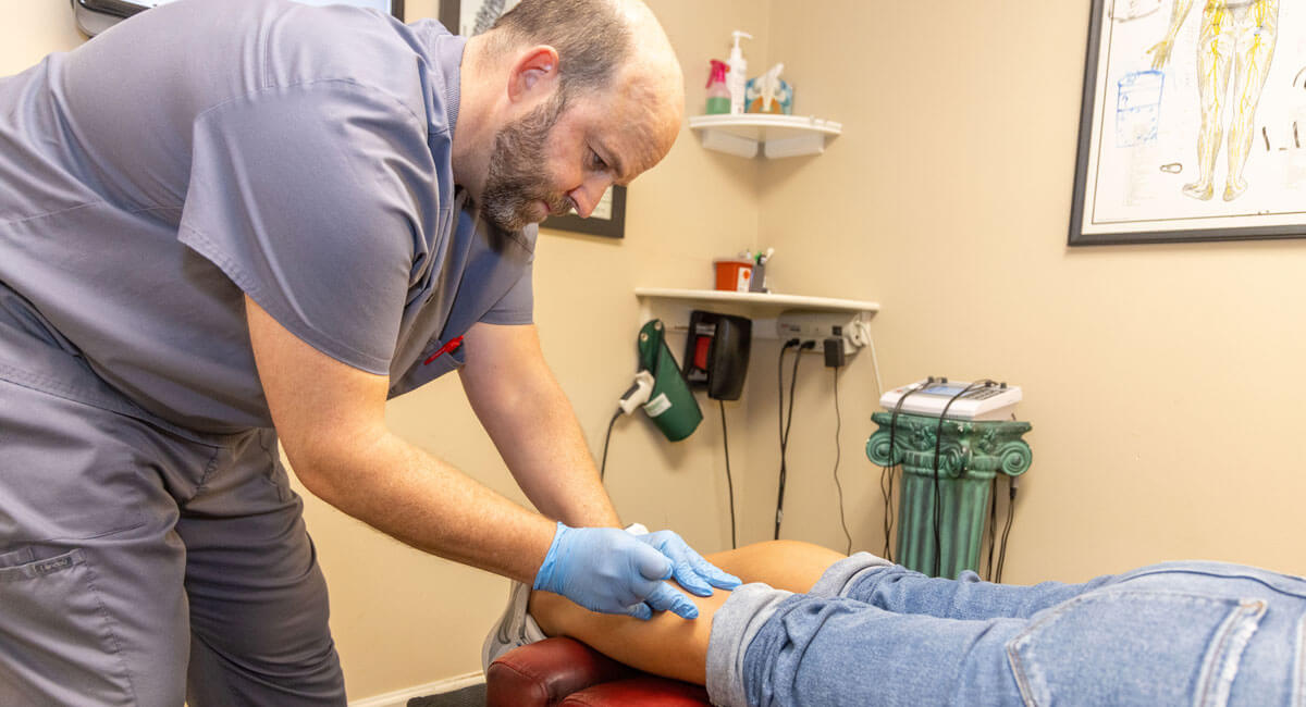 Dr. Cole dry needling woman's leg