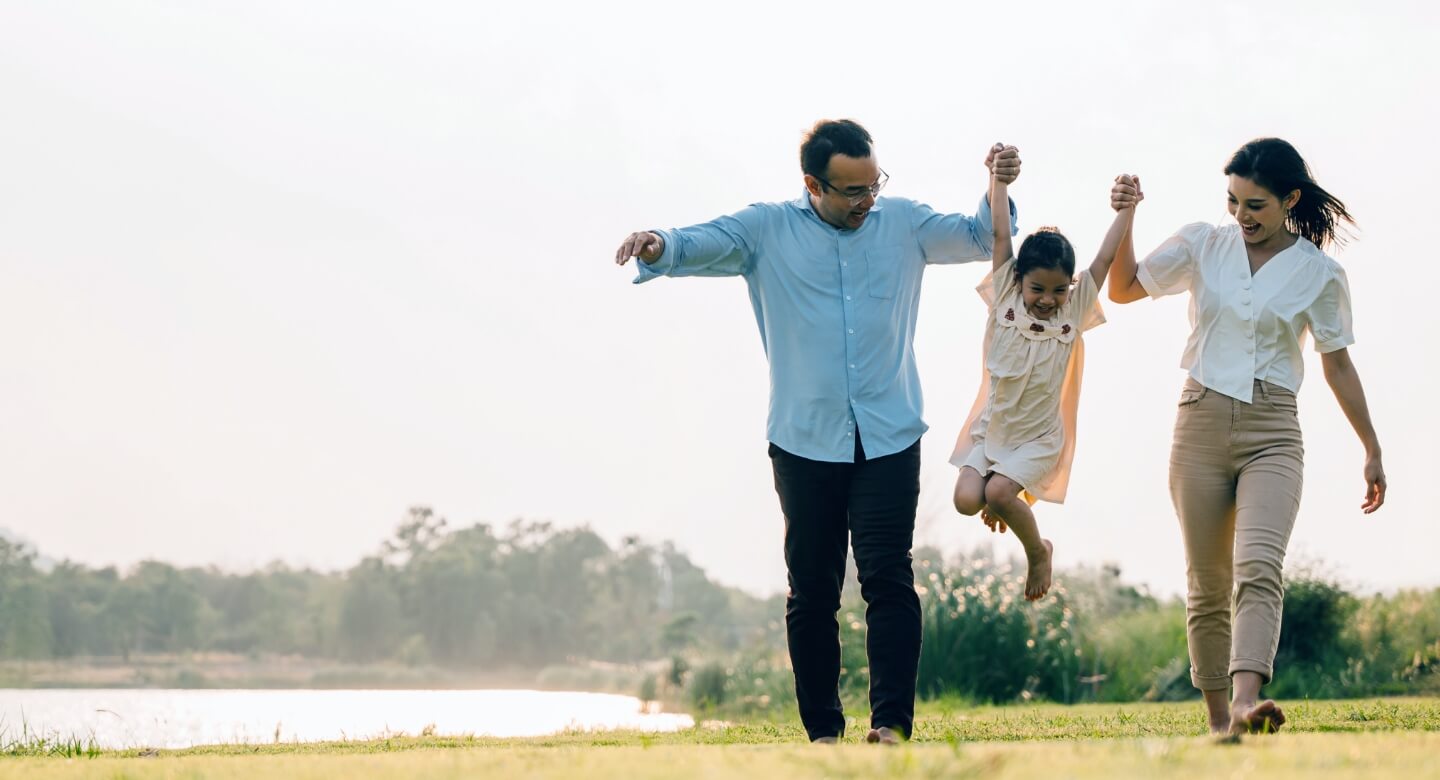 Smiling mom, dad and young daughter