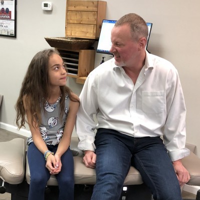 Doctor with a child chiropractic patient