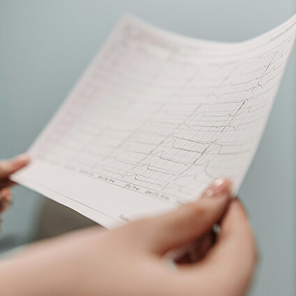 person reading a heart scan chart