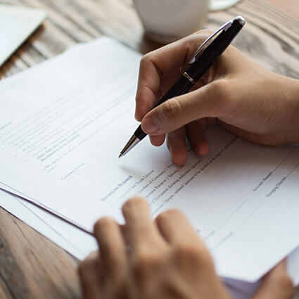 person filling out paperwork