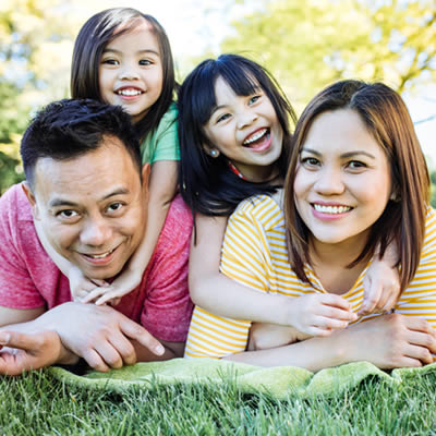 Asian family on grass