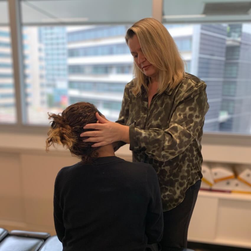 patient having neck adjusted