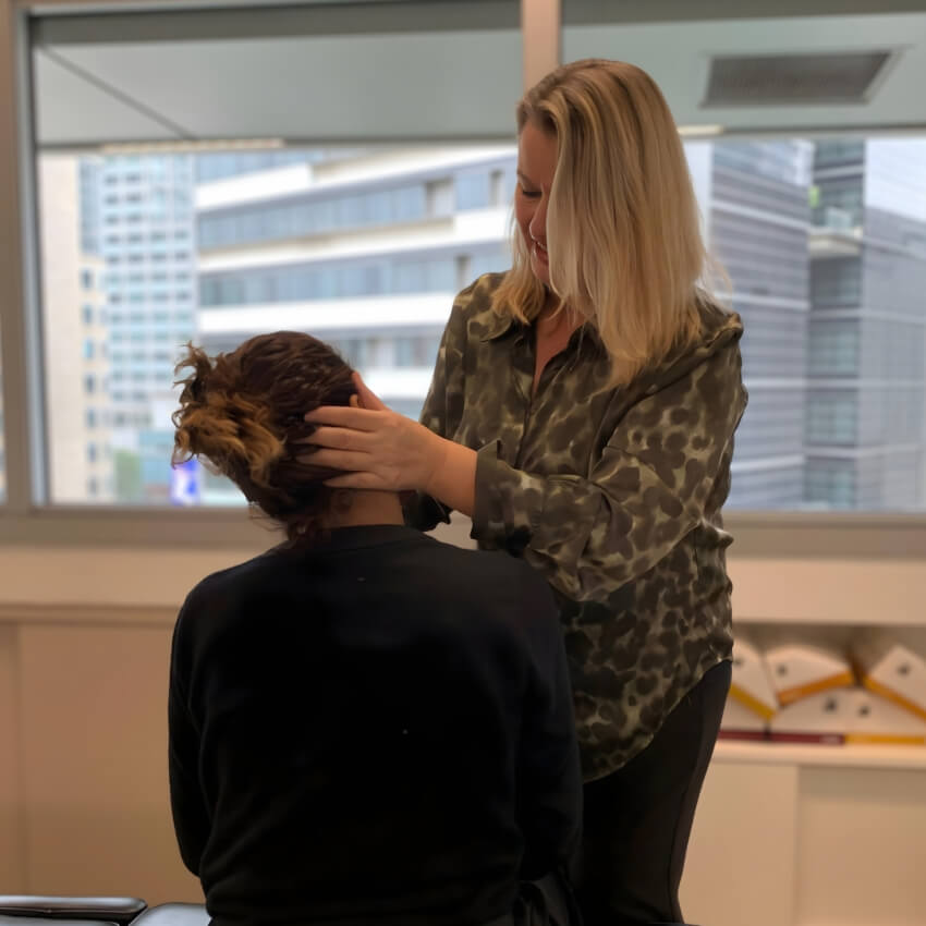 Genesis Chiropractic patient having neck adjusted