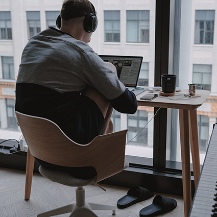 person working at their laptop at a desk