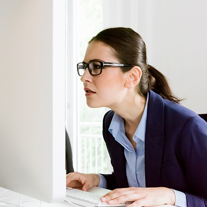 woman slouching at computer desk