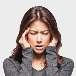 woman holding her head with a headache