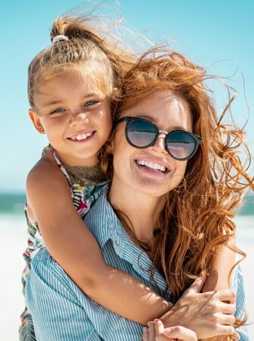 Mom and daughter on the beach