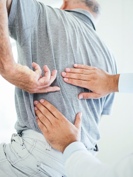 person having back examined
