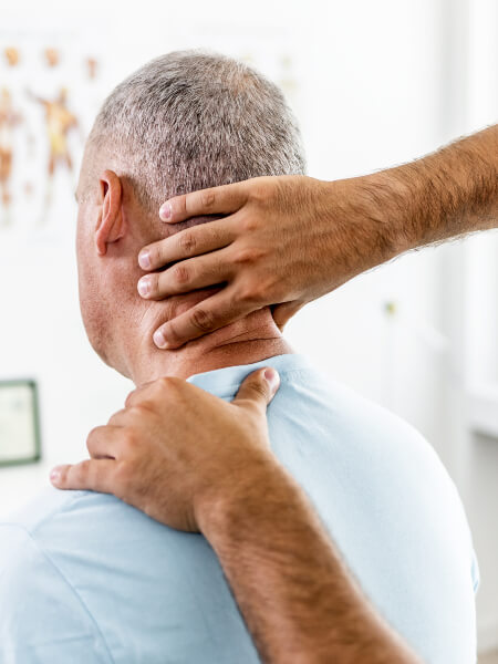 person having their neck examined