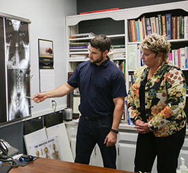 Visit Uthoff Family Chiropractic, PC to learn more about how you can live a happier, healthier life. Dr. Brad Uthoff showing xrays